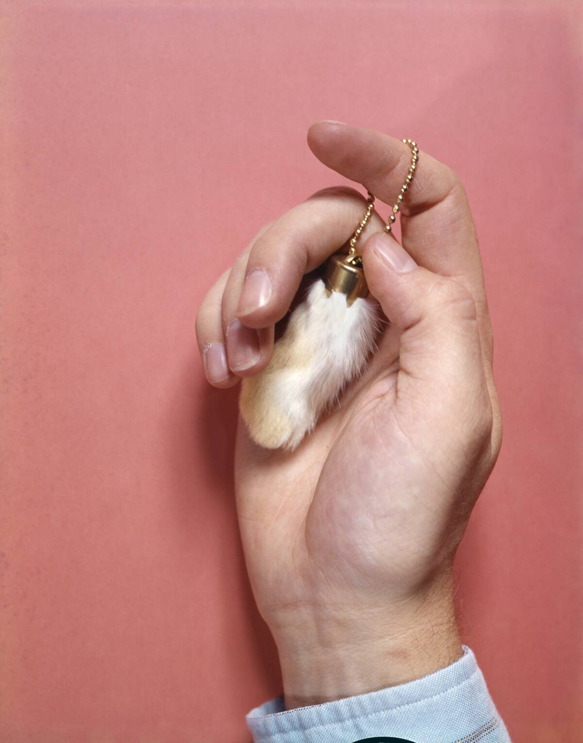 MALE HAND HOLDING A...